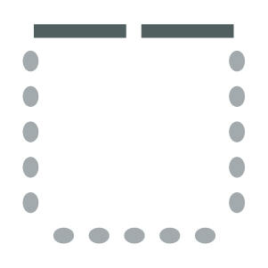 chairs arranged around the parameter of the room with screen in front